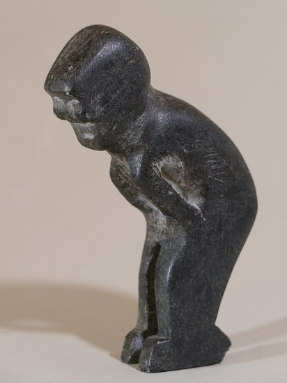 John Tiktak, Man leaning over
Stone, 4 3/4 x 1 1/4 x 3 1/2 in. (12.1 x 3.2 x 8.9 cm)
This charming small figure nevertheless exhibits classic Tiktak features -- the face with rounded cheeks and generous negative space between the arms and the body.  
03573-2