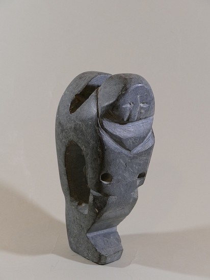 John Kavik, Mother and child, c. 1980
Stone, 9 1/2 x 3 x 4 in. (24.1 x 7.6 x 10.2 cm)
This is an unusually complex carving for John Kavik.  The structure of the composition, with generous negative space between the bodies of mother and child, is reminiscent of John Tiktak's mother-and-child sculptures.  But the angular heads and faceted bodies are pure Kavik.
03569-2