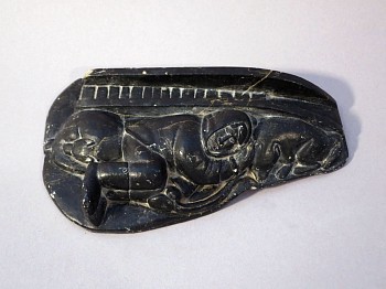 Work: Hunter sleeping with dogs and sled