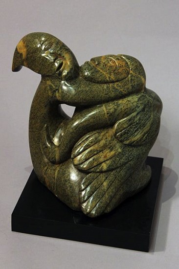 Abraham Anghik, Bird/sedna transformation
Brazilian soapstone,  (39.4 x 35.6 x 25.4 cm)
SOLD
This complex transformation is an excellent example of Abraham Anghik Ruben's artistry.   Sedna, the Inuit governing spirit of the sea and its creatures, is entwined around and merges with a large bird and another spirit, all executed in a beautiful green-brown stone.  Traditional Inuit believed that shamans could transform into other creatures, and many sculptures depict various stages of such transformations.  Abraham Anghik Ruben was born in Paulatuk, but as a child was sent south to a state school.  As an adult, he settled near Vancouver, and carves imported Brazilian soapstone.  He has worked to reconnect, through his art, with traditional Inuit beliefs and images. His work was showcased in a recent single-artist exhibit by the Smithsonian Institution National Museum of the American Indian.
01210-1
