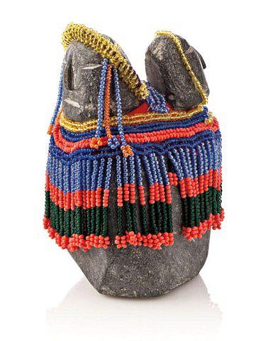 Eva Talooki Aliktaluk, Mother and child, c. 1980-1989
Stone, beads, 4 3/4 x 3 1/4 x 3 1/4 in. (12.1 x 8.3 x 8.3 cm)
Talooki's beadwork ranges from a few simple strands in some cases to highly elaborate clothing and adornments that have the look almost of royal regalia or liturgical vestments.  In an example like this, the beadwork is not mere trimming, it becomes the defining characteristic of the work.
01624-1
Sold