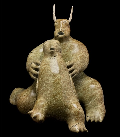 Nuyaliaq Qimirpik, Horned Spirit and Owl, 1968-70
17 x 15 1/2 x 17 in.
For a brief period of perhaps no more than three or four years (c. 1968-1971), a small group of carvers in Kimmirut, led by Nuyaliaq, created a remarkable and delightful group of spirit carvings, apparently at the request of a local schoolteacher named Tony Whitbourne who was buying carvings for the government for a short time. This spiritual flowering of art reminds us of a similar occurrence in nearby Cape Dorset in the early 1960s, but unfortunately in the case of Kimmirut art the florescence was not sustained â€“ a sad loss for Inuit art.


Nuyaliaq's Horned Spirit and Owl is a splendid example of the style. On the one hand the sculpture is poetic and haunting, on the other, it is incredibly charming. The horned figure might in fact be a transforming shaman; its overall posture and very human hands contrast with the bear-like body and bird-like head. The large figure holds its young owl companion almost as if presenting it as an offering or readying it for a spiritual journey. Both mouth and beak are agape in awe.


Today Nuyaliaq Qimirpik is best known as an accomplished carver of muskoxen. It is our pleasure to offer this sculpture by the artist as a work of profound spirituality and captivating beauty.


References: For other fine spirit sculptures by this artist see Bernadette Driscoll, Baffin Island, (Winnipeg Art Gallery, 1983) cat. 57, or Darlene Wight, The Swinton Collection of Inuit Art, (Winnipeg Art Gallery, 1987) cat. 134; Maria von Finckenstein ed., Celebrating Inuit Art 1948-1970, (Canadian Museum of Civilization, 1999) p. 129. A fine Spirit with Young from c. 1968 is illustrated in George Swinton, Sculpture of the Inuit, (McClelland & Stewart, 1972/92), fig. 517, p. 195. Three of Nuyaliaq's spirit sculptures are illustrated in Maria von Finckenstein, â€œFour Works from Kimmirutâ€ in Inuit Art Quarterly, (Vol. 14, No. 1, Spring 1999:40-41). 
03571-1